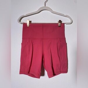 Athleta Salutation Stash 7” shorts LIKE NEW